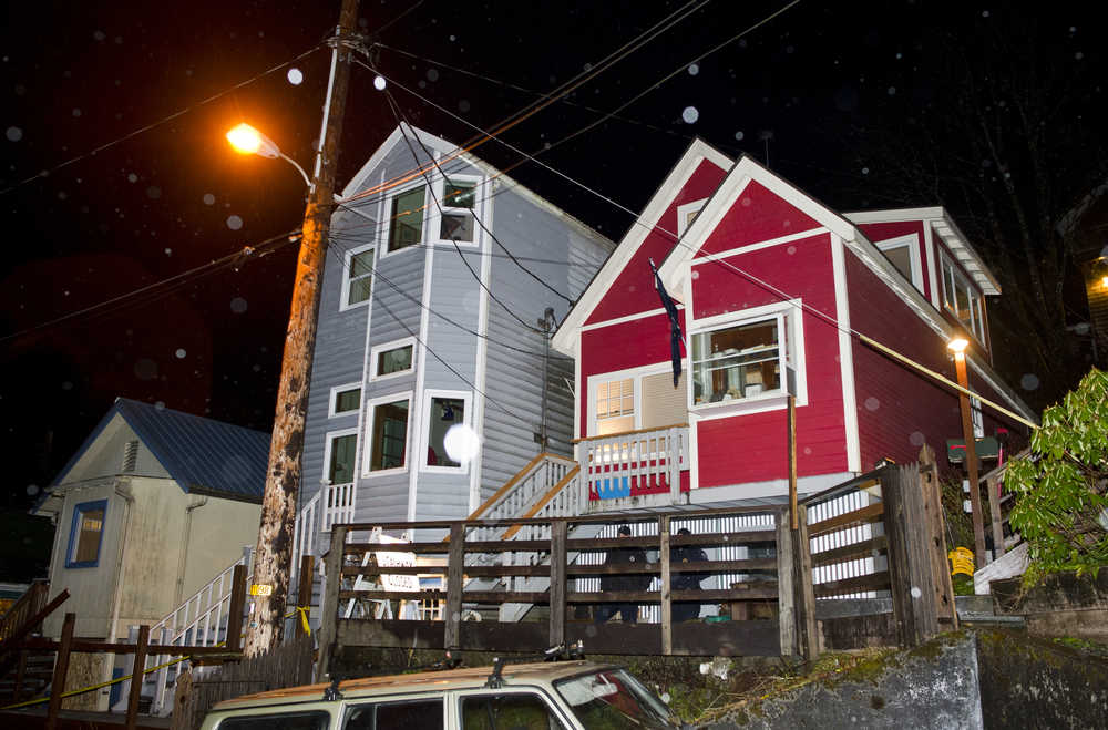 Two Juneau Police Department officers stand guard outside of Mayor Greg Fisk's house at 421 Kennedy Street Monday evening.