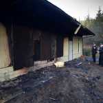 Capital City Fire/Rescue Fire Marshal Daniel Jager, right, and Deputy Fire Marshal Sven Pearson investigate a fire at the Emmanuel Baptist Church on Wednesday. It appears the fire started in a vehicle outside the back wall of the church Tuesday night.