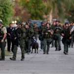 Authorities search for a suspect following a shooting that killed multiple people at a social services facility Wednesday in San Bernardino, California.