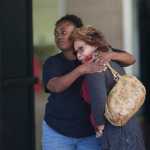 Two women embrace at a community center where family members are gathering to pick up survivors after a shooting rampage Wednesday in San Bernardino, California.