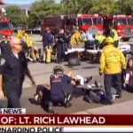 First responders attend to people outside a Southern California social services center in San Bernardino, where gunmen opened fire Wednesday.