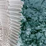 Wing over water---a seagull just flying by.