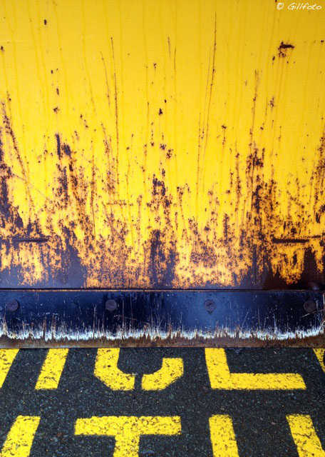 Rusty rig and pavement.