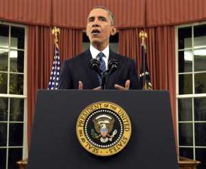 President Barack Obama addresses the nation from the Oval Office at the White House Sunday night.