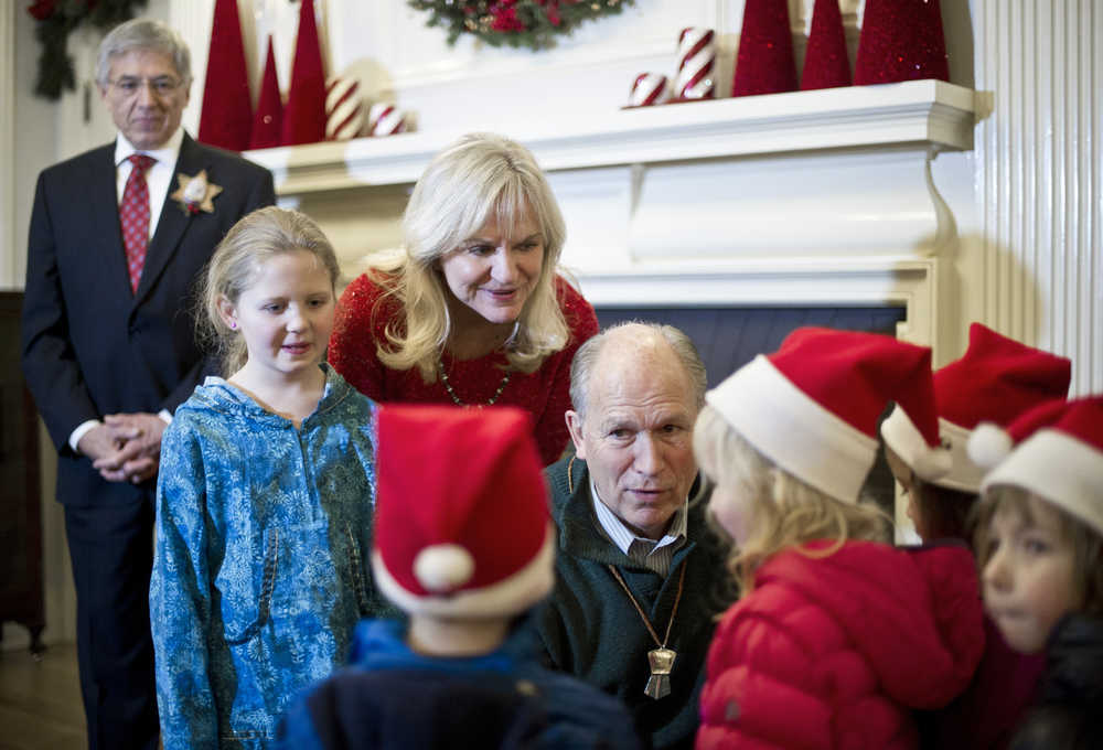 Gov. Bill Walker,his wife, Donna, and Lt. Gov. Byron Mallott, left, greet children from the Discovery Preschool at the Governor's Open House on Tuesday.