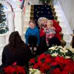 First Lady Donna Walker spends time with her grandchildren, Walker Linderman, 11 months, and Mera Hobson, 7, as they wait for the doors to open for the Governor's Open House on Tuesday.