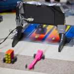 Two CO2-powered dragsters race off the starting line during teacher Alan Denerger's technology class at Floyd Dryden Middle School on Thursday.