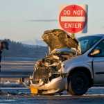 A Capital City Fire/Rescue firefighter attends to a two-vehicle accident on Egan Drive at Vanderbilt Hill Road Friday morning.