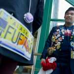 Exchange students Rifqi Zulfahm, right, of Indonesia, and Marcellin Niset, of Belgium, show off their decorated jackets during an interview on Thursday. Both are attending high school in Juneau as part of the Rotary Youth Exchange Program.