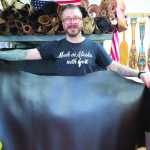Dan Ewing holds a hide he'll use to create some of the leather products he sells at Ewing Dry Goods.