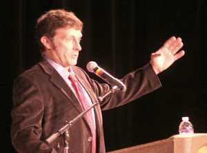 Ian Fisk, the son of late Juneau Mayor Stephen "Greg" Fisk, talks about his father during a celebration of life held in the elder Fisk's honor Sunday at Centennial Hall.