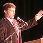 Ian Fisk, the son of late Juneau Mayor Stephen "Greg" Fisk, talks about his father during a celebration of life held in the elder Fisk's honor Sunday at Centennial Hall.