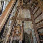 In the Hudson Adit is a 145-foot shaft. This bucket was used to remove rock from the bottom of the shaft.  On the right side of the image is an alarm bell, rung if something happened to the pumps that keep the shaft dry.