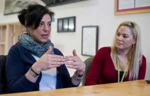 Kara Nelson, left, and Christina Love, both addicts in long-term recovery, are trained recovery coaches, helping guide drug addicts into recovery.