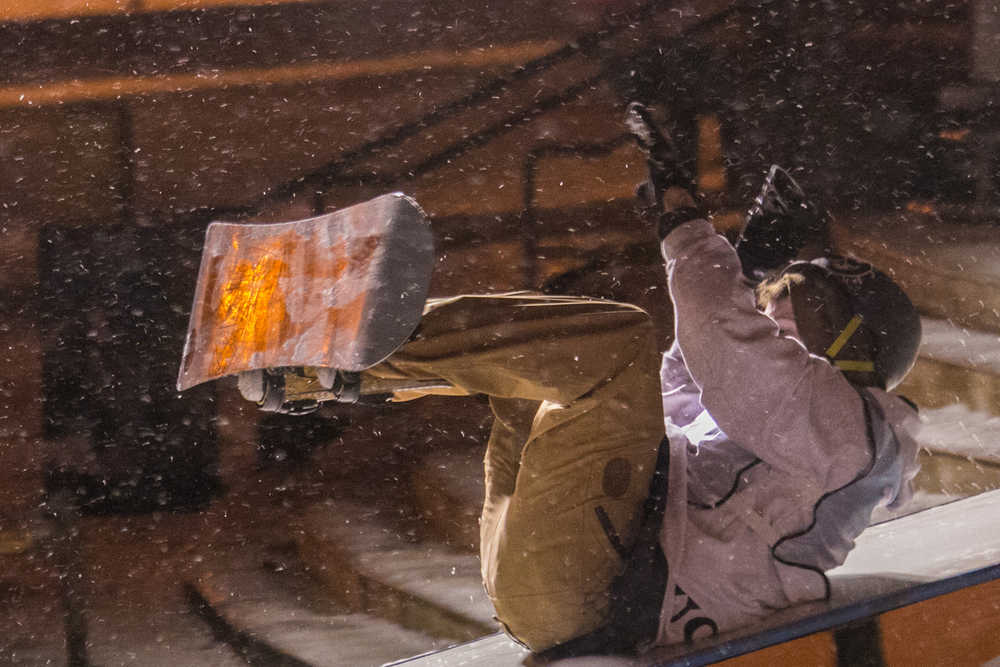 And he's safe! A competitor slides to a finish at Eaglecrest's Downtown Rail Jam on Saturday.
