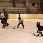 Youth hockey players compete Dec. 15 during a hockey exhibition game with many of the Juneau Douglas Ice Association hockey players who attend Gastineau Elementary.