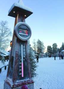 A thermometer reads minus-nine Celsius in Santa Claus Village, around 8 kms, 5 miles north of Rovaniemi in Finland on Tuesday Dec. 15, 2015. Most kids learn that Santa Claus comes from the North Pole, but children in Scandinavia are taught he lives a bit further south. Where exactly is a matter of much debate, with businesses in Finland, Sweden and Norway competing to cash in on the cache that comes with claiming Santa's hometown.(AP Photo/James Brooks)