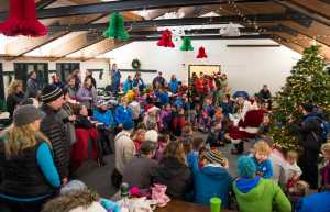 The Eaglecrest lodge is full and decorated at the Christmas Eve at Eaglecrest event on Thursday. The evening events included crafting, cider and cookies, story time, a Hooter torchlight parade and a Porcupine torchlight parade, followed by Santa's arrival and gift-giving. Over 80 gifts were given out by Santa.