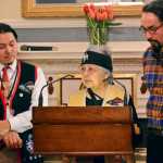Lance Twitchell, left, and Ishmael Hope stand with Nora Marks Dauenhauer as she reads traditional Tlingit oratory by Naa Tláa (Jessie Dalton of Hoonah) during an Indigenous Readings event hosted by First Lady Donna Walker at the Governor's Mansion in October.