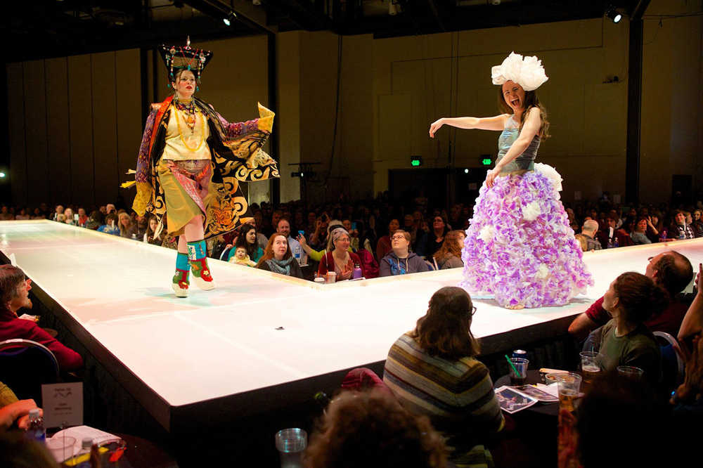 New Traditions, a two-part piece created by Sarah Cannard, Vicki Young, Cathy Anderson and Kay Haneline, and modeled by Cannard (right) and Adriane Honerbrink, is shown during the 2015 Wearable Art Show sponsored by the Juneau Arts & Humanities Council at Centennial Hall in February. The piece on the left, representing the East, was made from fabric and other materials salvaged from thrift stores, and the piece on the right, representing the West, was made from plastic bags.