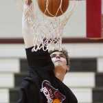 Juneau-Douglas' Bryce Swofford puts in his final attempt to win the dunking contest at the Capital City Classic at JDHS on Sunday. Other winners included Caitlin Pusich and Molo Maka, both of JDHS, in the free throw competitions. Chugiak's Nicole Pickney and Kent Lake's Michael Alar won their respective three-point contests.