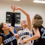Thunder Mountain's Ava Tompkins and two Chugiak players collide as they go for the ball on Saturday.