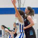 Thunder Mountain's Ava Tompkins guards Chugiak's Courtney Kuhlmann during Saturday's game.