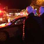 Gov. Bill Walker, right, is on the scene of a small plane crash early Tuesday morning in Anchorage.