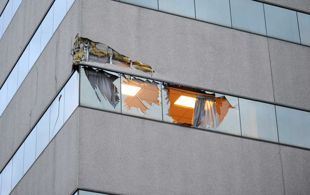 This Dec. 29 photo shows damage to the corner of The Brady Building after a small plane crashed into it in downtown Anchorage.