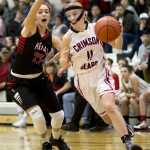 Juneau-Douglas' Kallen Hoover, right, drives to the basket against Kenai's Alexis Baker during the Princess Cruises Alaska Airlines Capital City Classic at JDHS on Tuesday.