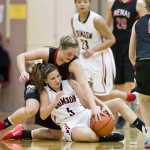 Juneau-Douglas' Erica Hurtte scuffles with Kenai's Abby Beck for the ball during the Princess Cruises Alaska Airlines Capital City Classic at JDHS on Tuesday.