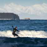 Chris Hinkley takes advantage of high winds from the north to surf off Lena Beach on Feb. 5.