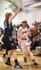 Juneau-Douglas' Kallen Hoover drives against Chugiak's Randi McMullen in the 2015 Princess Cruises Alaska Airlines Capital City Classic Wednesday. Chugiak won 48-42.
