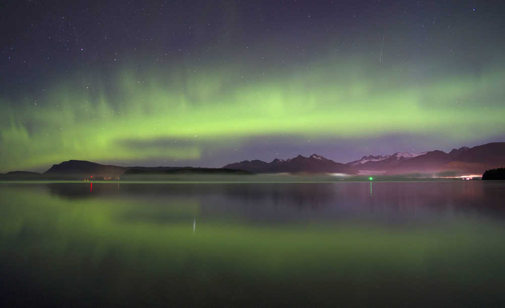Northern lights and one shooting star light up the sky over the mainland as seen from Douglas Island the morning of 0ct. 5.
