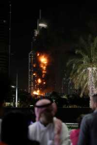 Smoke and flames pouring from a residential building, which also contains the Address Downtown Hotel, in Dubai, United Arab Emirates on New Year's Eve.