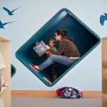 Jessica Walsh reads to her son, Silas, 3, in a carpeted nook on the first day of the new Mendenhall Valley Public Library on Oct. 5.