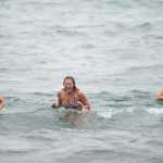Matt Kern, Lia Heifetz, center, and Katey Blagden react to the cold water during the 24th annual Polar Bear Dip at the Auke Village Recreation Area on Friday, Jan. 1, 2016.