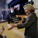 Democratic presidential candidate Hillary Clinton, right, greets people in the audience as she arrives at a town hall campaign event Sunday in Derry, New Hampshire.
