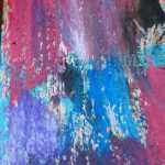 Splotches of color highlight the side of a birdfeeder in Fairbanks.