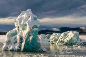 Icebergs rest on the frozen Mendenhall Lake near the glacier on a recent afternoon.