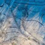 Ice patterns emerge on a wetlands pond.