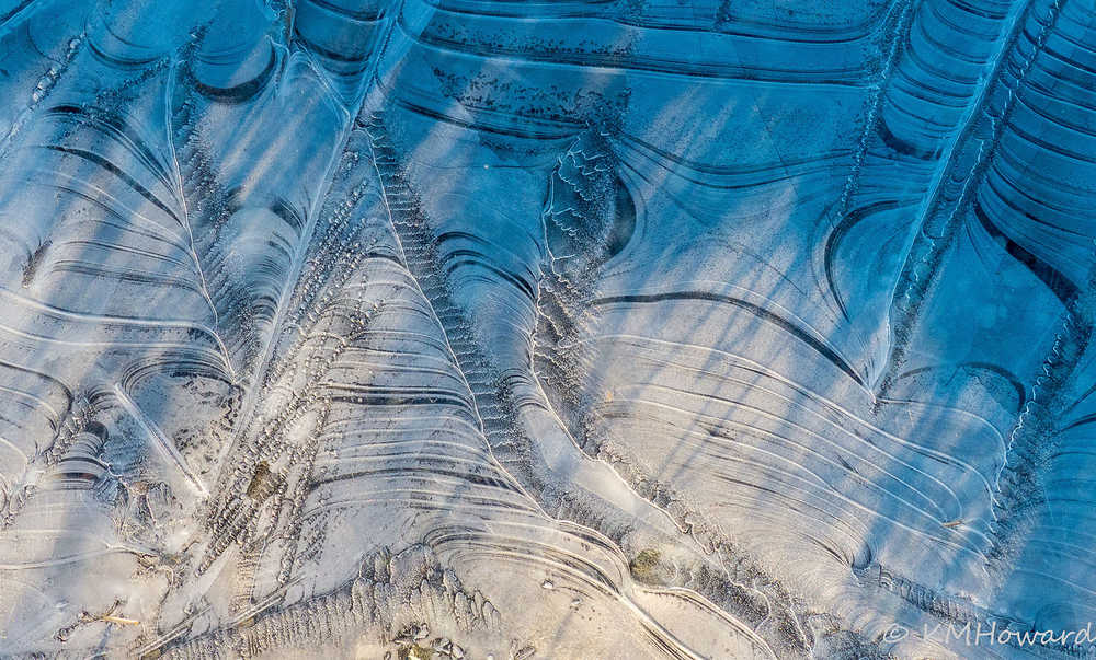 Ice patterns emerge on a wetlands pond.