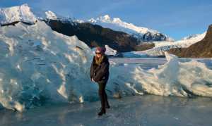 Lexi Lodwig skates with her puppy, Lola, through stranded icebergs on Mendenhall Lake on Wednesday.