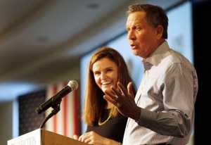 Republican presidential candidate, Ohio Gov. John Kasich, accompanied by Jessica Nickel, speaks during a stop at an Addiction Policy Forum on Jan. 5 in Hooksett, New Hampshire.