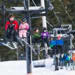 Students and instructor ride the Porcupine Chairlift as they participate in the the World's Largest Lesson at Eaglecrest on Friday as part of Learn to Ski and Snowboard Month. The event, that included 80 participants and 17 instructors, was part of a national attempt to break a Guinness World Record.