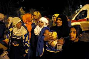 In this Monday photo, people wait to leave the besieged town of Madaya, northwest of Damascus, Syria. U.N. humanitarian chief Stephen O'Brien said about 400 people need to be evacuated immediately to receive life-saving treatment for medical conditions, malnourishment and starvation.