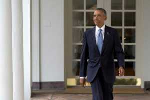 President Barack Obama walks along the colonnade of the White House in Washington, Tuesday, Jan. 12, 2016, to the residence from the Oval Office, hours before giving his State Of The Union address. (AP Photo/Carolyn Kaster)