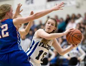 Thunder Mountain's Haleigh Dicarlo looks to pass against Sitka's Zosha Krupa during their game at TMHS on Thursday. Thunder Mountain won 40-39.