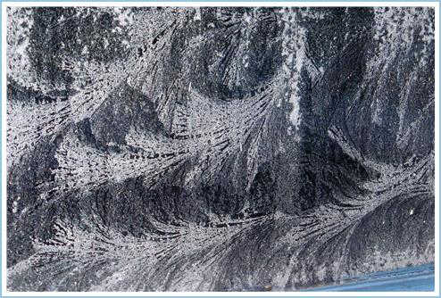 Feathery window designs on a cold winter day.