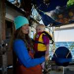 Lexi Fish Hackett and her daughter, Isla, on the family boat, the F/V Myriad. Photo by Ash Adams